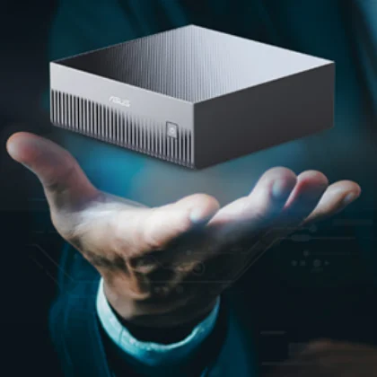 An ASUS Ascent GX10 — a GB10-based desktop AI supercomputer — held in one hand